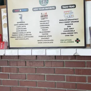 a menu on a brick wall