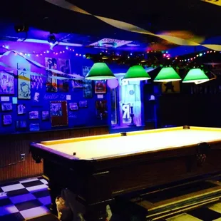 a pool table in a bar