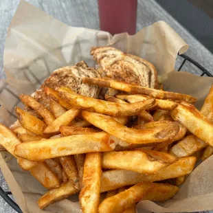 a basket of fries and a sandwich