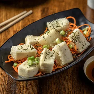 a plate of tofu and carrots