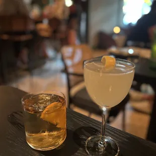 two cocktails on a bar
