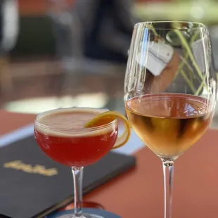 two glasses of wine on a table