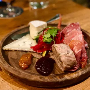 a plate of meat and cheese