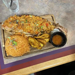 Tilapia, plantains and jollof.