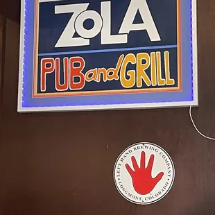 a sign for zola pub and grill