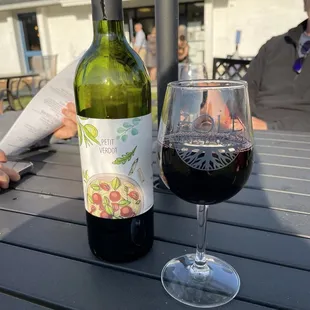 a glass of wine and a bottle of wine