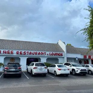 cars parked in front of the restaurant