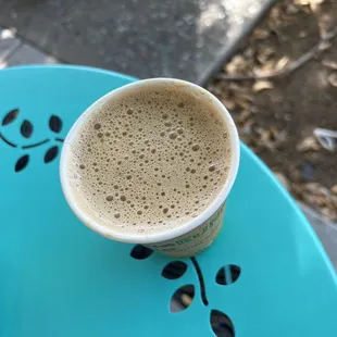 a cup of coffee on a table