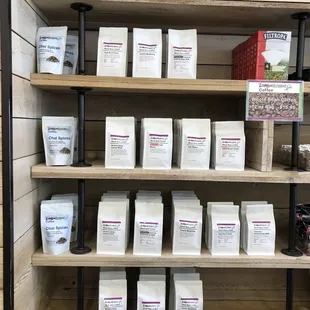 a shelf full of coffee beans