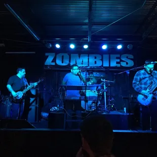 a band performing on stage at a concert