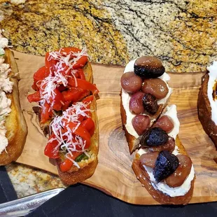 a variety of appetizers on a cutting board