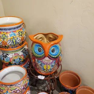 Pots  and a colorful owl.