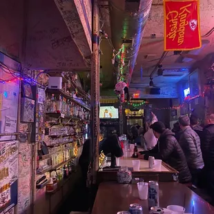 people sitting at the bar and drinking