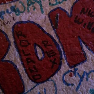 graffiti on the wall of a bar