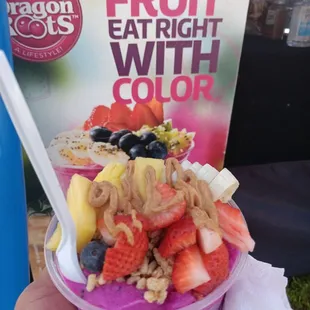 Dragon Fruit with strawberries, banana, blueberries, granola, peanut butter and honey