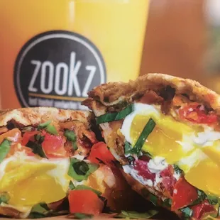 No 11   Two Poached Eggs, bacon, cheddar cheese, cream cheese, tomatoes and fresh basil