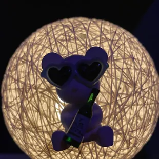 a teddy bear with sunglasses and a cell phone