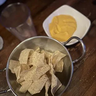 Complimentary nacho cheese and chips