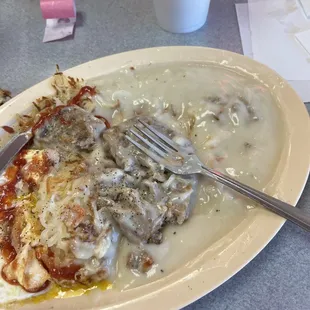 Country chicken fried steak with over medium egg and hash brown
