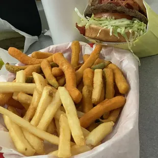 Pastrami cheeseburger with fries and zucchini