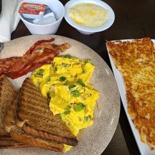 Mini breakfast- 2 scrambled eggs added green peppers and onions, bacon hashbrowns, added $4 side of grits