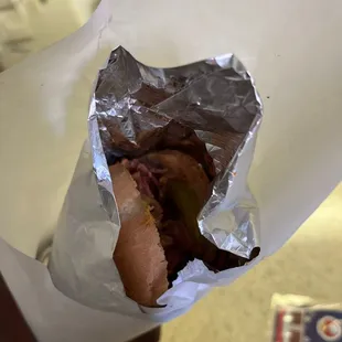 a sandwich wrapped in foil