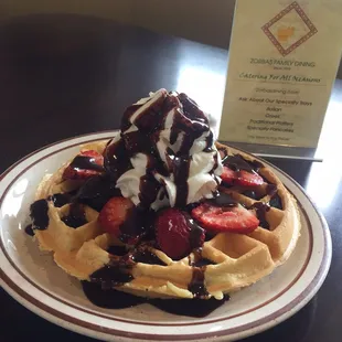 Waffles with fresh strawberries, fresh blueberries, whipped cream &amp; chocolate syrup