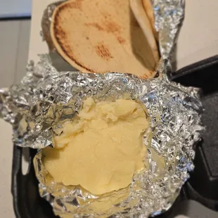 This is supposed to be &quot;Flaming Feta&quot;. It is not feta and there are no tomatoes, oregano, spiced peppers or olive oil.