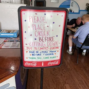 a sign in a restaurant