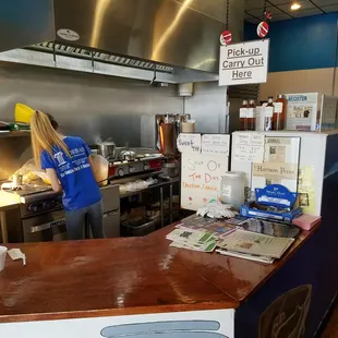 The counter and the look at the grill and fries area