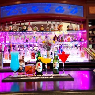 a bar with various drinks