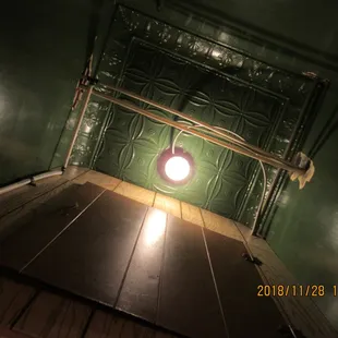 This shot from the restroom shows that this building once had those wonderful stamped metal ceilings.