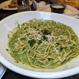 a bowl of pasta with pesto