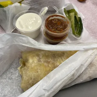 Egg burrito with cheese and extra veggies. Courtesy homemade pickles.