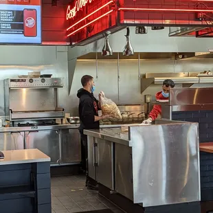 Frozen fries. Mask under worker's nose whole time.