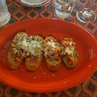 a plate of bread with cheese on it