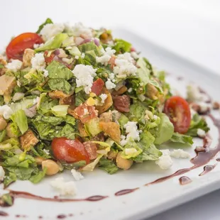 a salad on a white plate