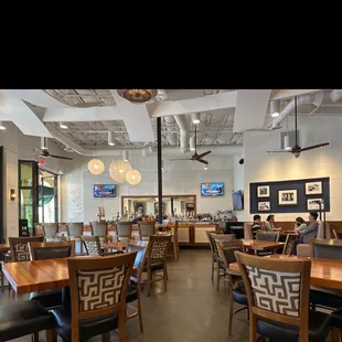 a dining area with tables and chairs