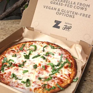 a pizza in a box on a table