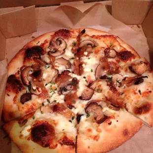 Tuscan mushroom, thyme, truffle oil, feta cheese, carmalized onion, roasted garlic sauce, mozzarella size small.