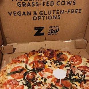 a pizza in a cardboard box