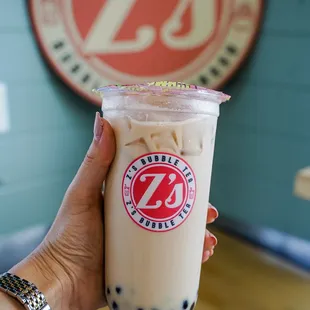  hand holding a cup of bubble tea