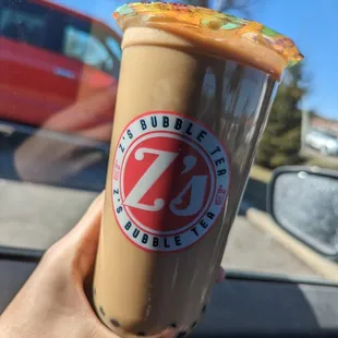 a hand holding a cup of coffee