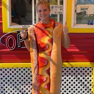 a boy in a hot dog costume