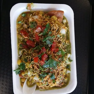 This is samosa chaat , they have so many delicious things,  pani poori, paneer wrap.