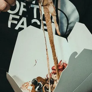 Creppuccini comes with two crepes chopped up like fettuccine and we add fruits and chocolate and one scoop of ice cream.