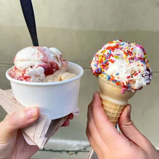 two ice cream cones with sprinkles