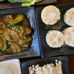 Bok Choi, thin mushrooms, corn on the cob, and marinated cucumber salad with sesame seeds. Yum.