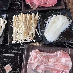 Beef, pork belly, mushrooms and clear noodles with uson noodles. These are the topping sizes