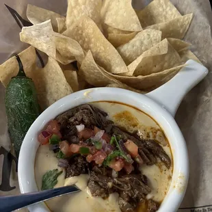 Birria Queso, so delicious!! Chips were not greasy and tasted just right! If you like queso, try this, you'll love it!